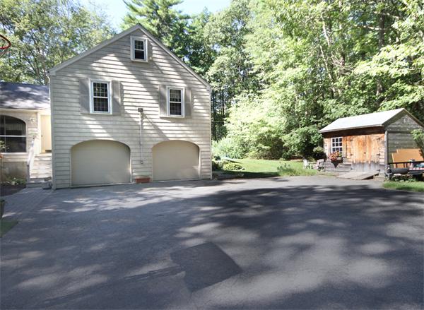 50 Towne Road Boxford, MA 01921 - Photo 27 of 30 a front view of a house with a yard and garage