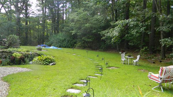 50 Towne Road Boxford, MA 01921 - Photo 30 of 30 a backyard of a house with table and chairs