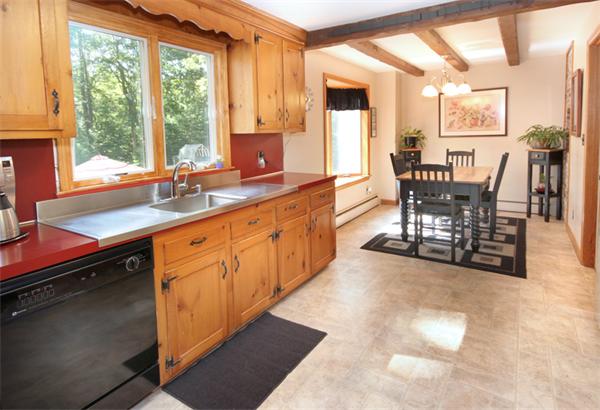 50 Towne Road Boxford, MA 01921 - Photo 6 of 30 a open kitchen with stainless steel appliances granite countertop sink stove and white cabinets