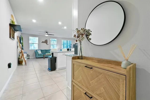 a room with a washing machine and a mirror