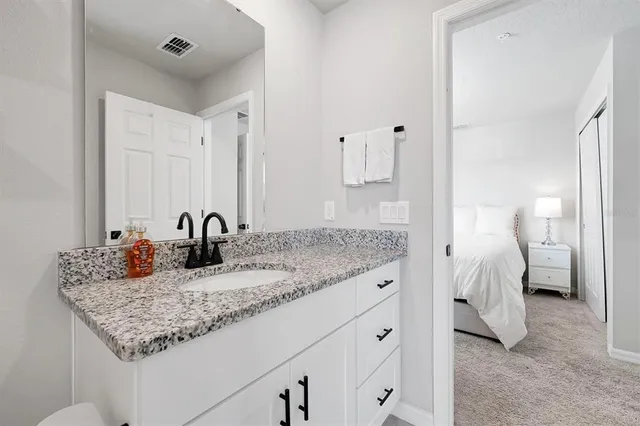 a bedroom with bed and window