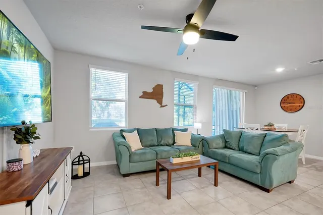 a living room with furniture and a window