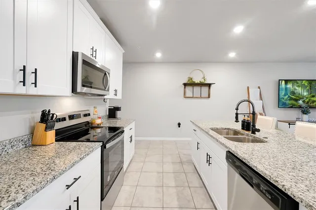 a kitchen with a sink and cabinets