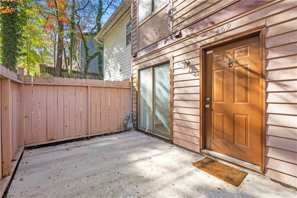 a view of a house with a door and wooden walls