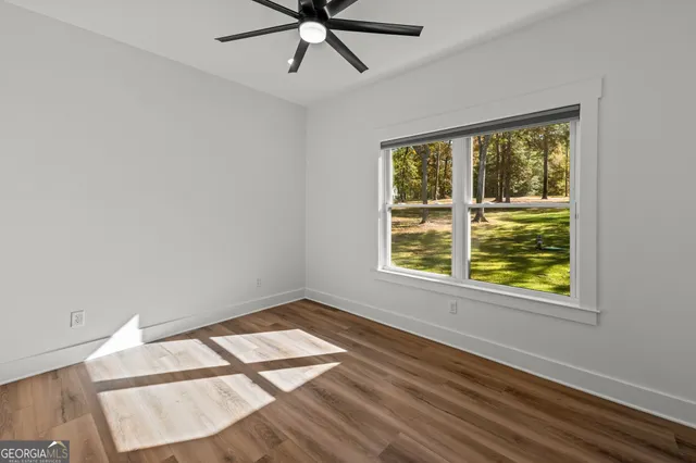 a bathroom with double vanity sinks and a shower