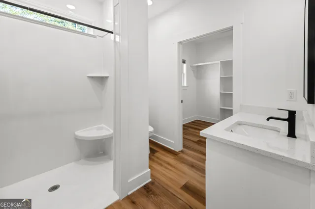 a room with cabinets and wooden floor