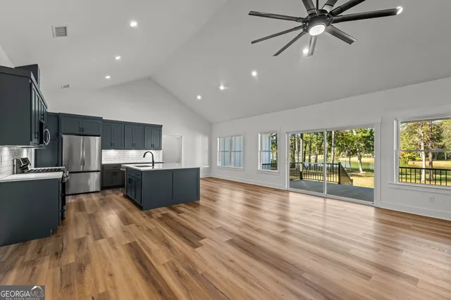 a view of swimming pool with outdoor seating and trees