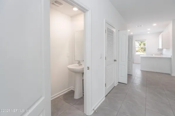 a kitchen with a sink cabinets and window