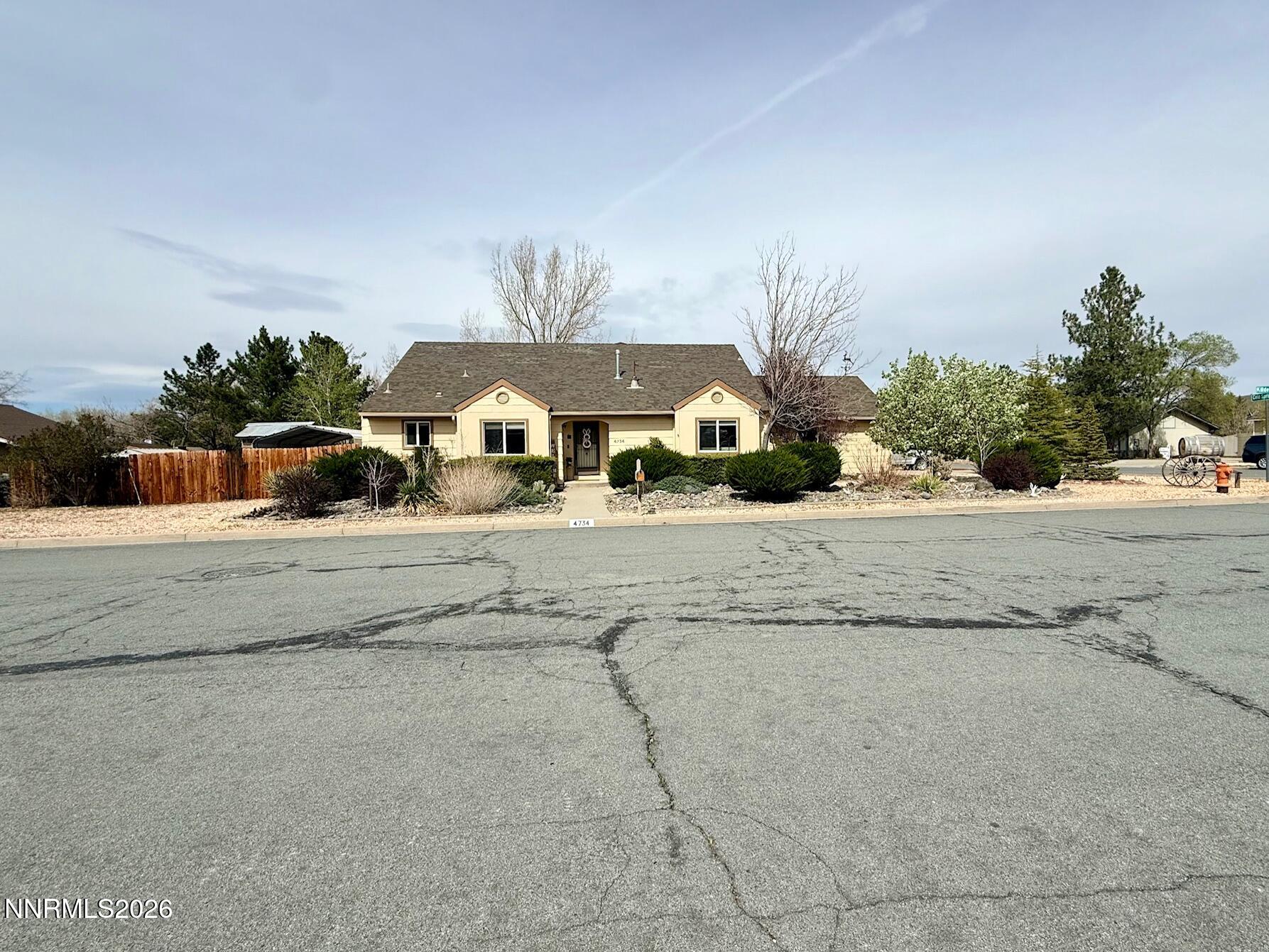 4734 Killdeer Road Carson City, NV 89701 - Photo 1 of 40 a front view of a house with a yard and garage