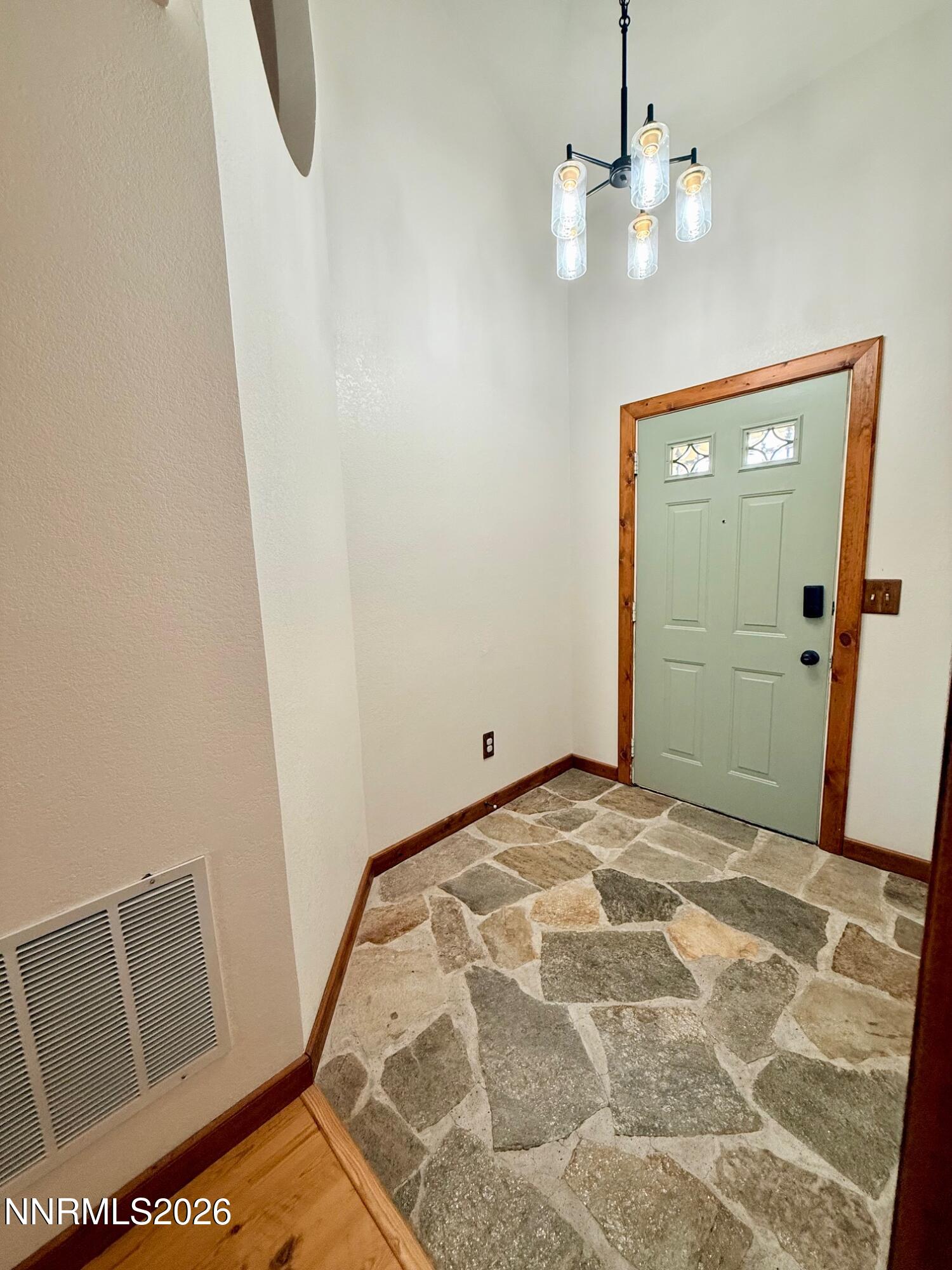 4734 Killdeer Road Carson City, NV 89701 - Photo 11 of 40 a view of a hallway with a chandelier