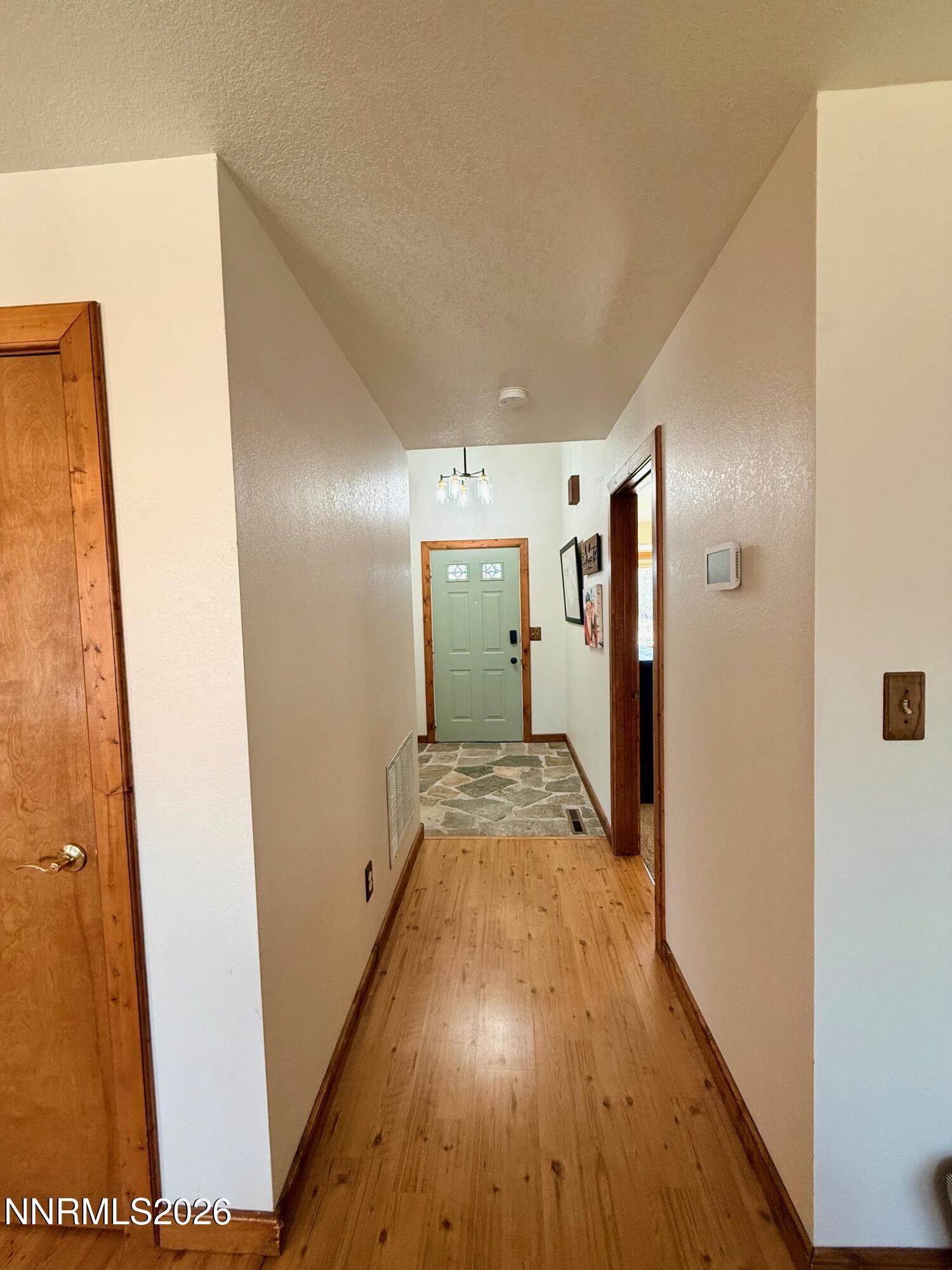 4734 Killdeer Road Carson City, NV 89701 - Photo 12 of 40 a view of hallway with wooden floor