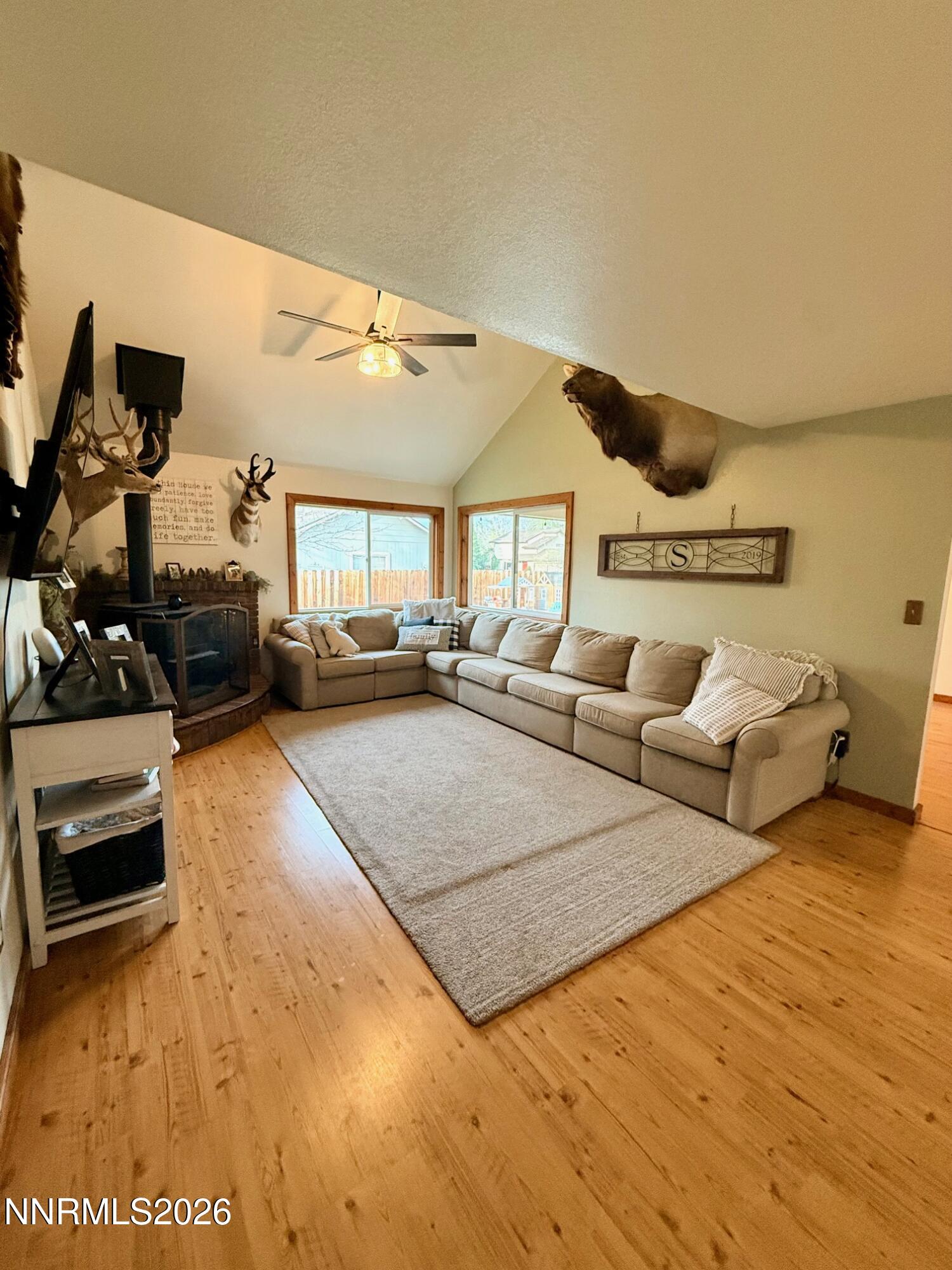 4734 Killdeer Road Carson City, NV 89701 - Photo 14 of 40 a living room with furniture and a flat screen tv