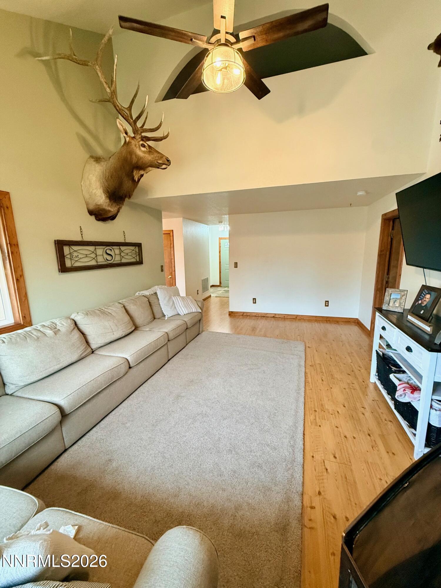 4734 Killdeer Road Carson City, NV 89701 - Photo 15 of 40 a living room with furniture and a flat screen tv