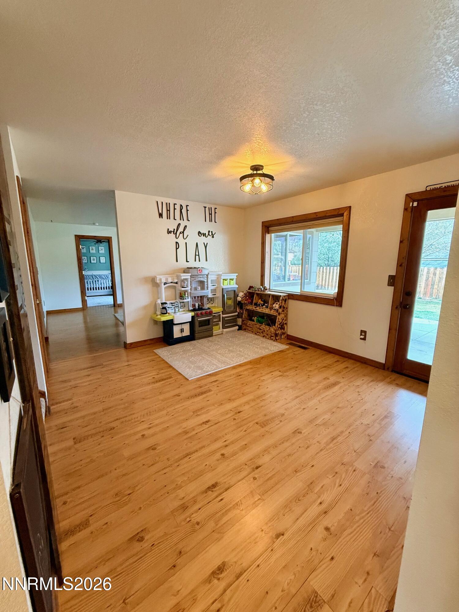 4734 Killdeer Road Carson City, NV 89701 - Photo 16 of 40 a living room with furniture and a large window