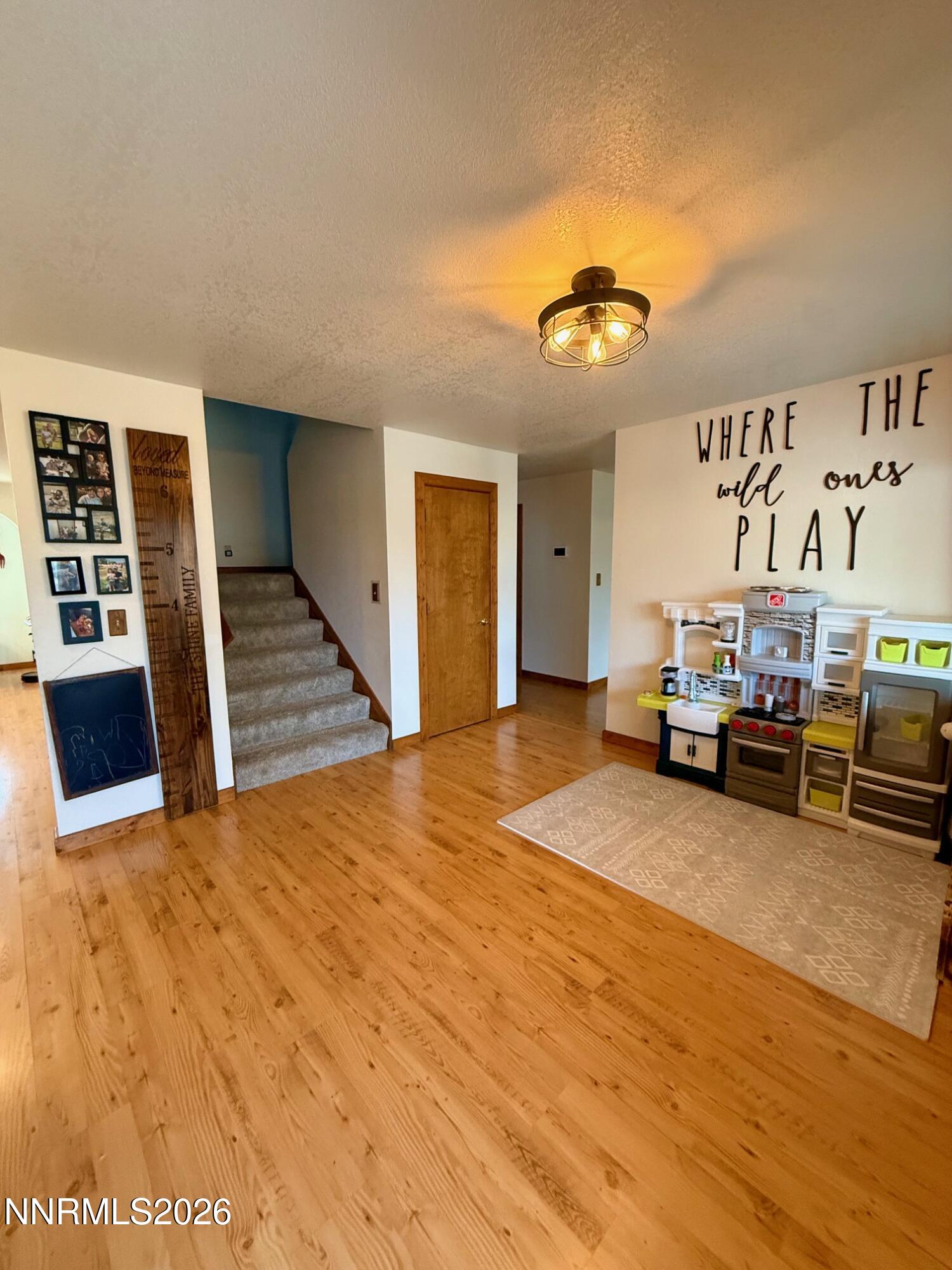 4734 Killdeer Road Carson City, NV 89701 - Photo 17 of 40 a view of a livingroom with furniture and a flat screen tv