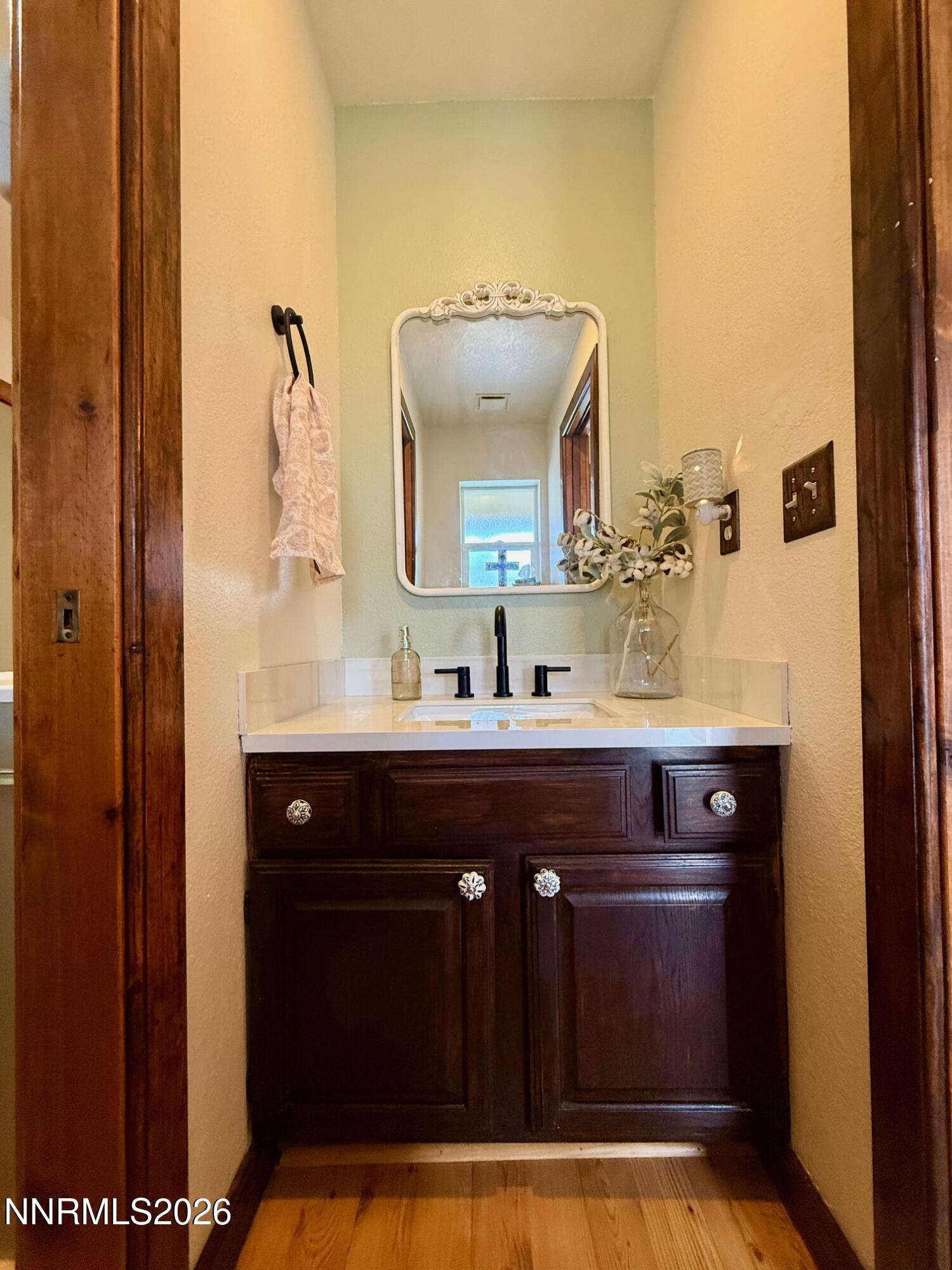 4734 Killdeer Road Carson City, NV 89701 - Photo 19 of 40 a bathroom with a sink and a mirror