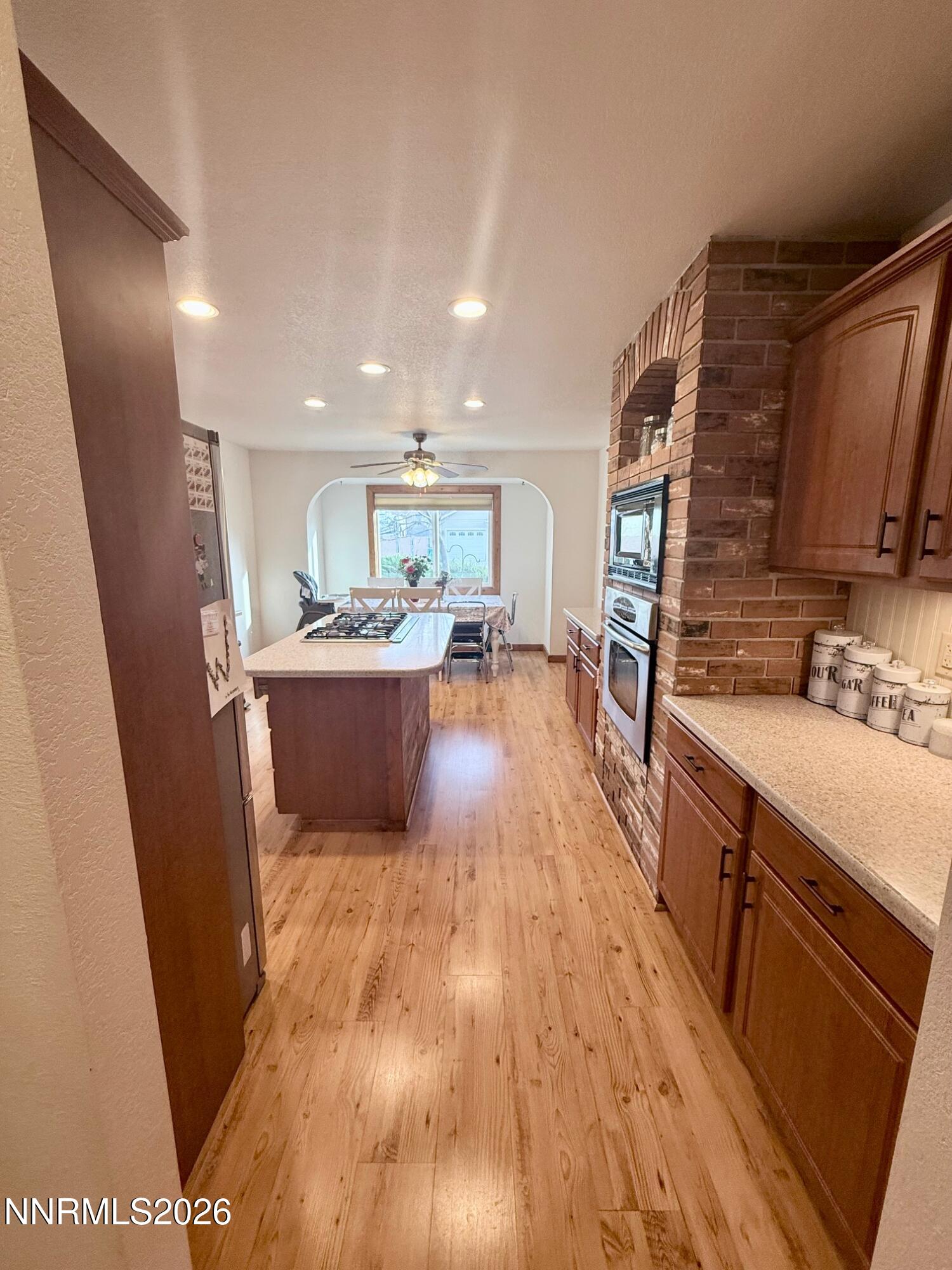 4734 Killdeer Road Carson City, NV 89701 - Photo 20 of 40 a large kitchen with stainless steel appliances kitchen island granite countertop a sink and cabinets