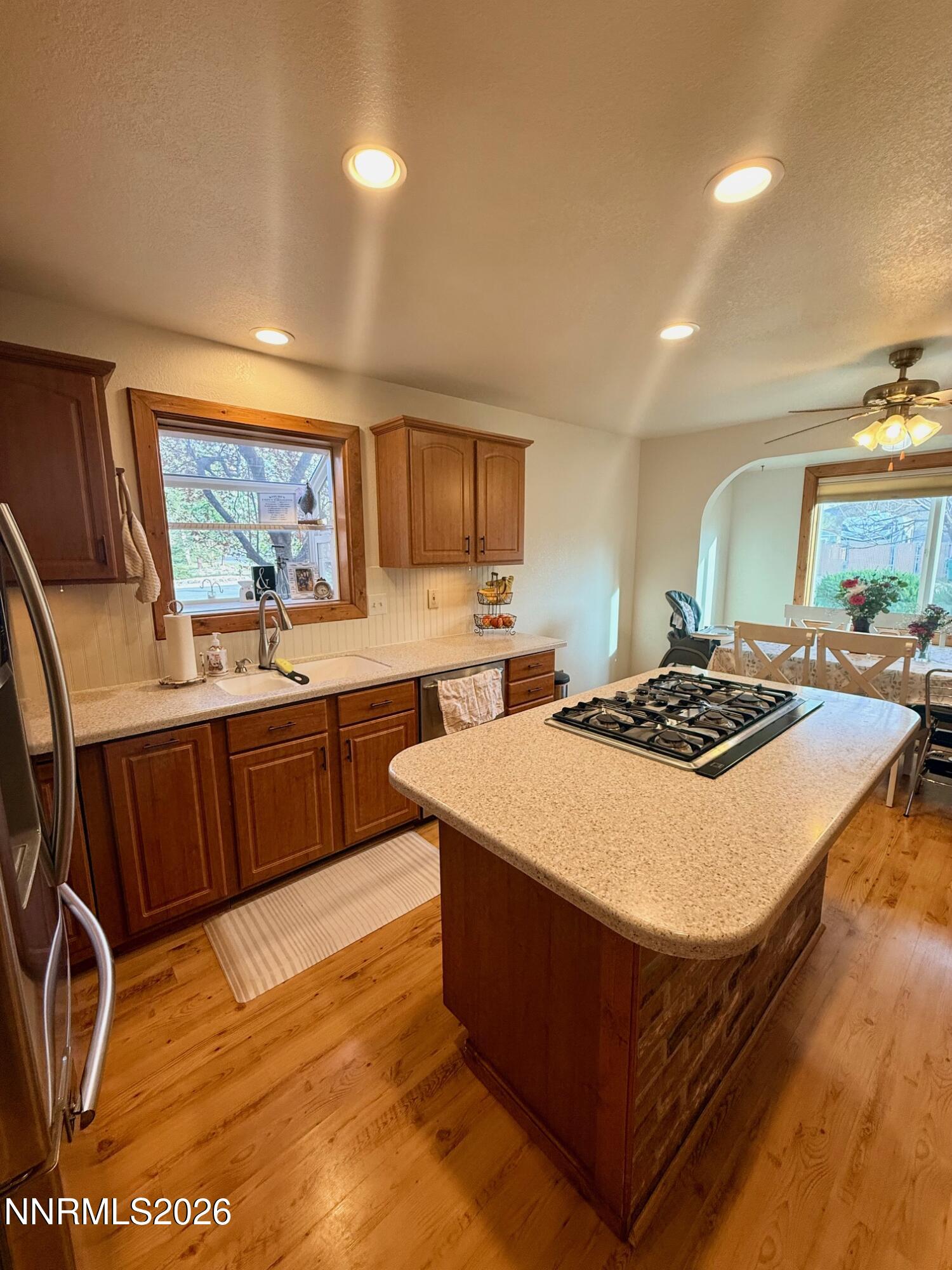 4734 Killdeer Road Carson City, NV 89701 - Photo 21 of 40 a kitchen with stainless steel appliances a stove a sink dishwasher and a refrigerator