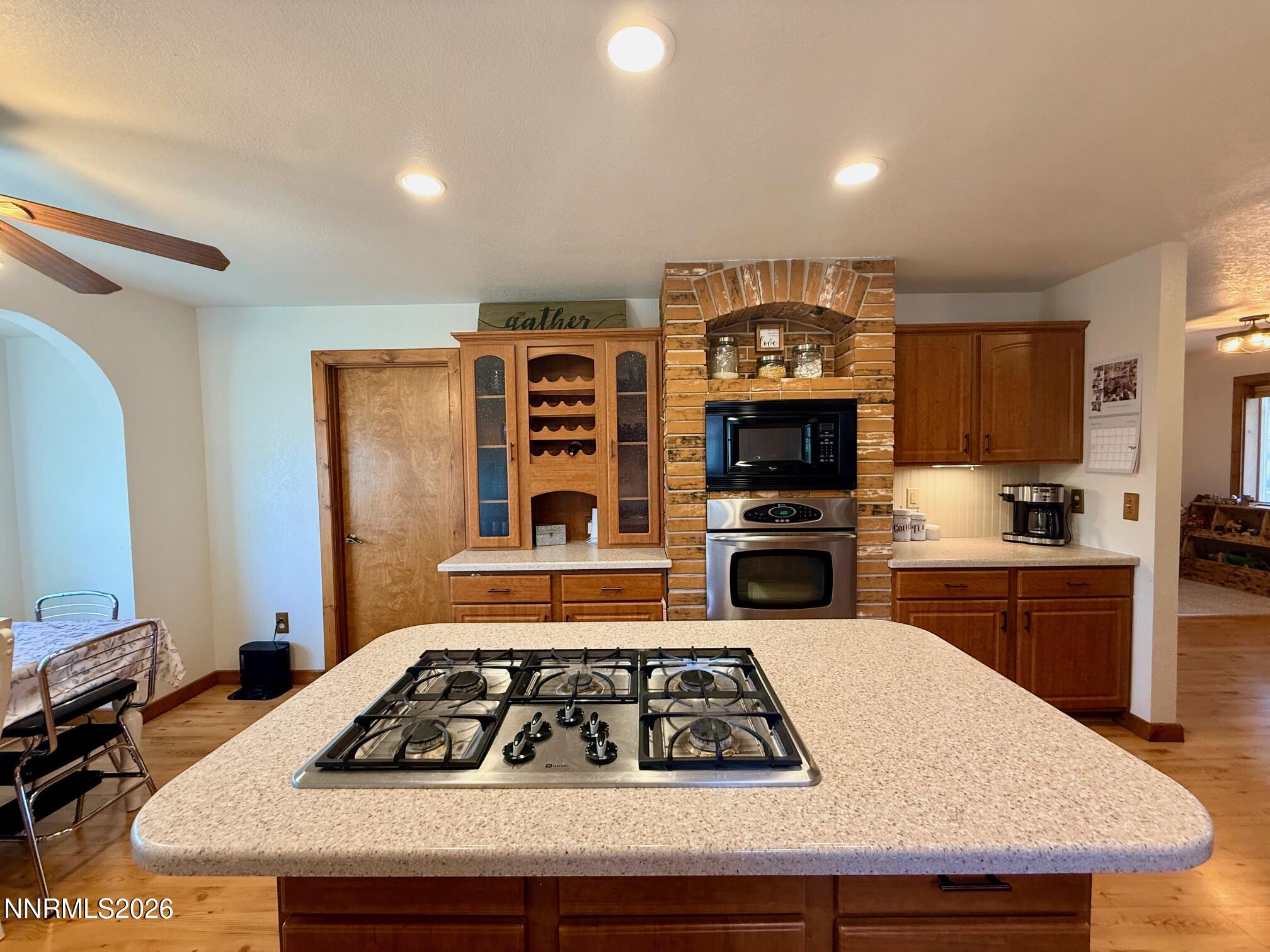 4734 Killdeer Road Carson City, NV 89701 - Photo 26 of 40 a kitchen with a stove a sink and a refrigerator