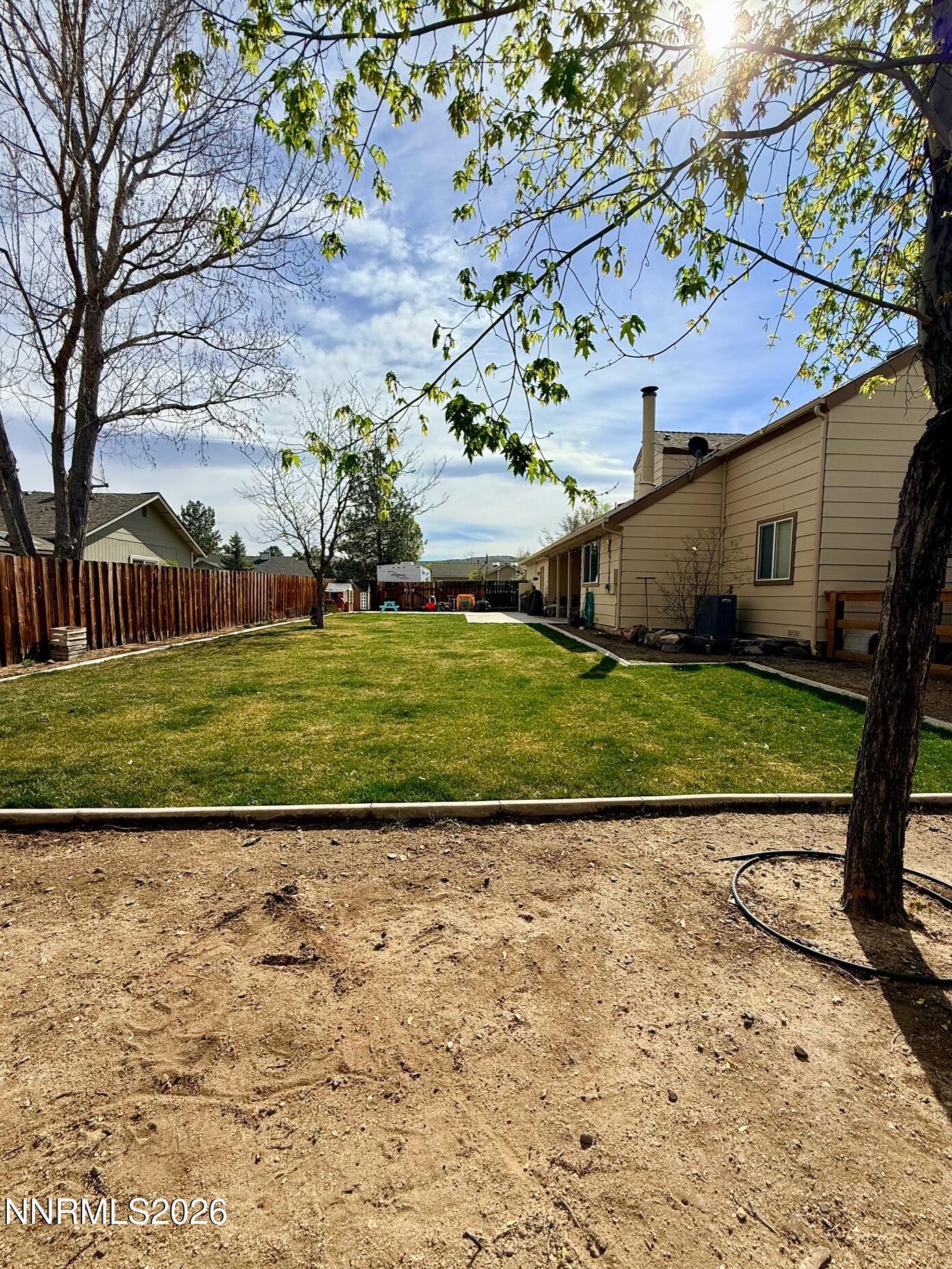 4734 Killdeer Road Carson City, NV 89701 - Photo 5 of 40 a view of a backyard with a garden