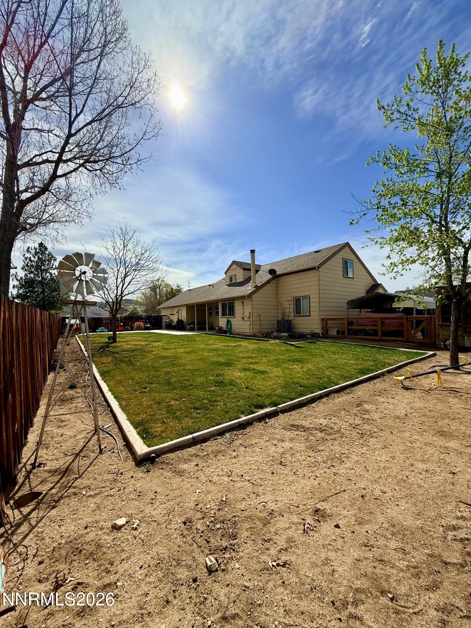 4734 Killdeer Road Carson City, NV 89701 - Photo 6 of 40 a view of a tennis ground with a large tree