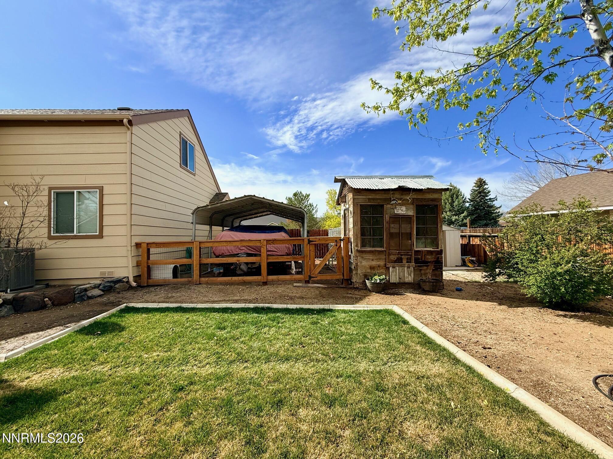 4734 Killdeer Road Carson City, NV 89701 - Photo 7 of 40 a house view with a sitting space and garden space
