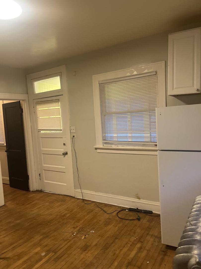 237 West 114th Street Chicago, IL 60628 - Photo 15 of 27 a view of an empty room with closet and a window
