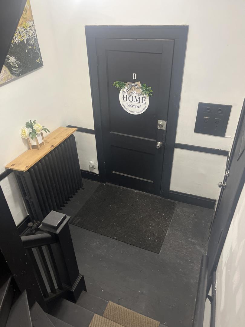 237 West 114th Street Chicago, IL 60628 - Photo 18 of 27 a view of cabinets with wooden floor