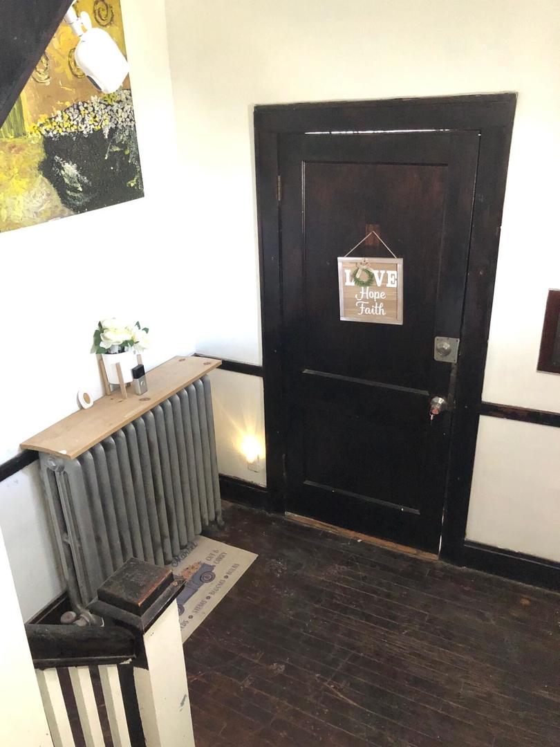 237 West 114th Street Chicago, IL 60628 - Photo 2 of 27 a view of a hardwood floor