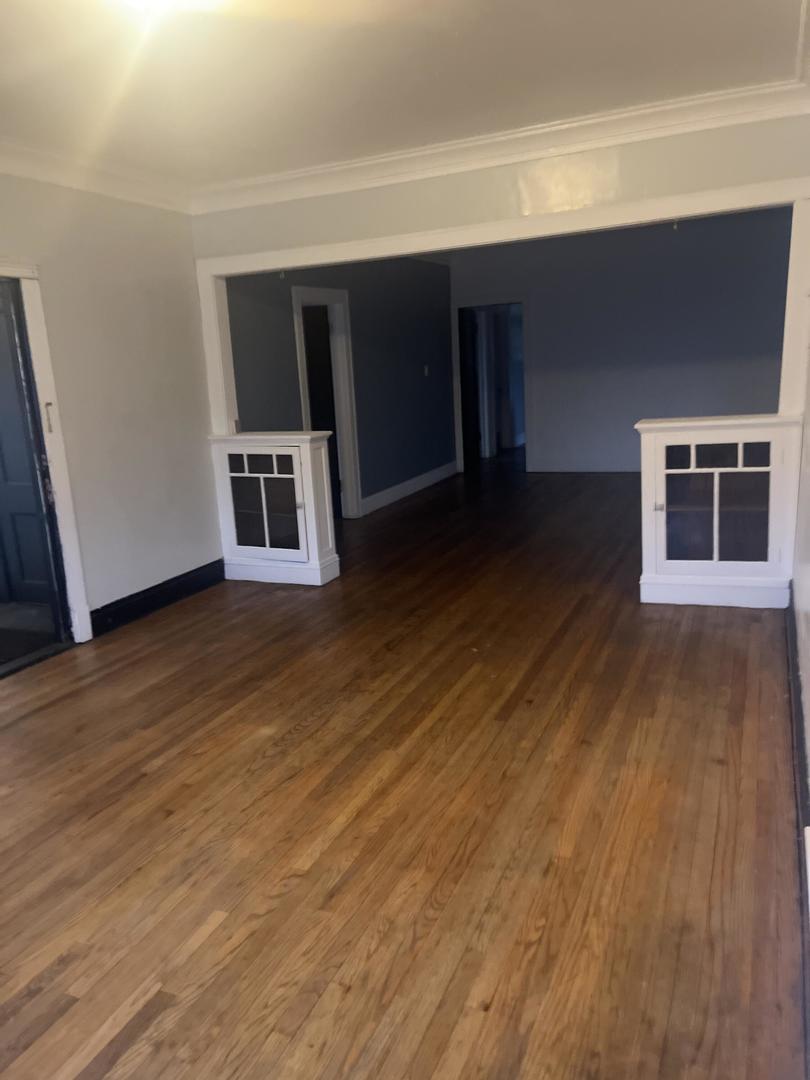 237 West 114th Street Chicago, IL 60628 - Photo 10 of 27 a view of a livingroom with wooden floor