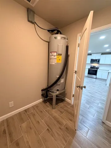 a view of a room with wooden floor and stairs