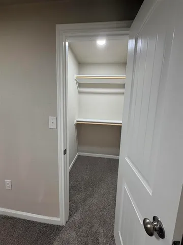 a bathroom with a double vanity sink a mirror and a bathtub
