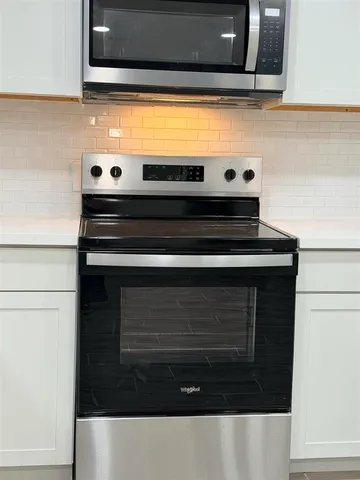 a bathroom with a sink and a microwave