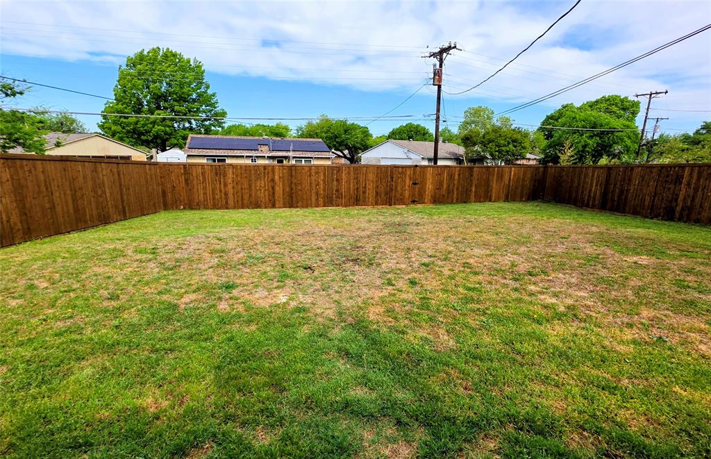731 Leading Lane Allen, TX 75002 - Photo 14 of 18 a bathroom with a small yard and wooden fence