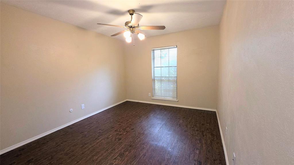 731 Leading Lane Allen, TX 75002 - Photo 8 of 18 wooden floor in an empty room with a window