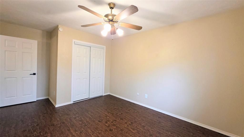 731 Leading Lane Allen, TX 75002 - Photo 9 of 18 an empty room with wooden floor and fan