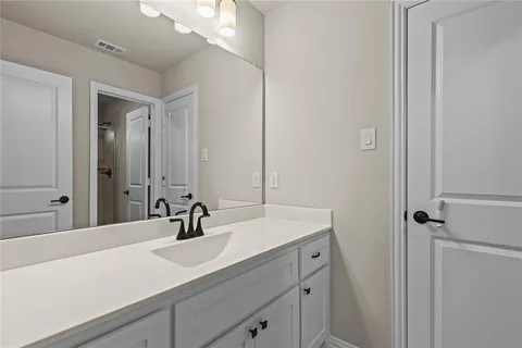 a bathroom with a shower and a toilet