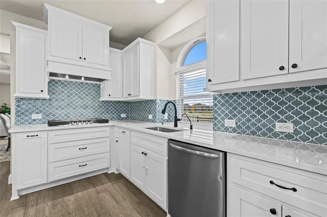 a dining room with furniture a chandelier and wooden floor