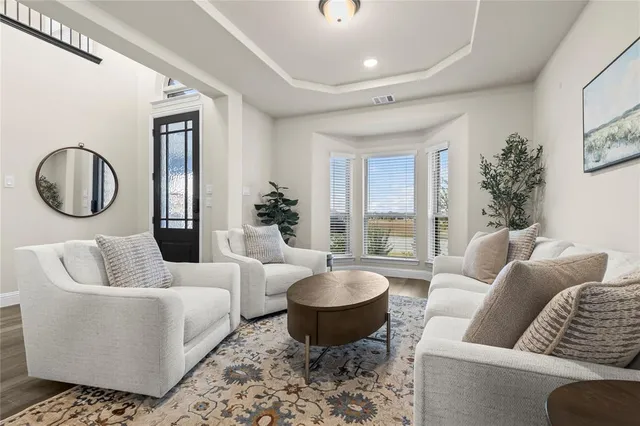a living room with furniture fireplace and flat screen tv