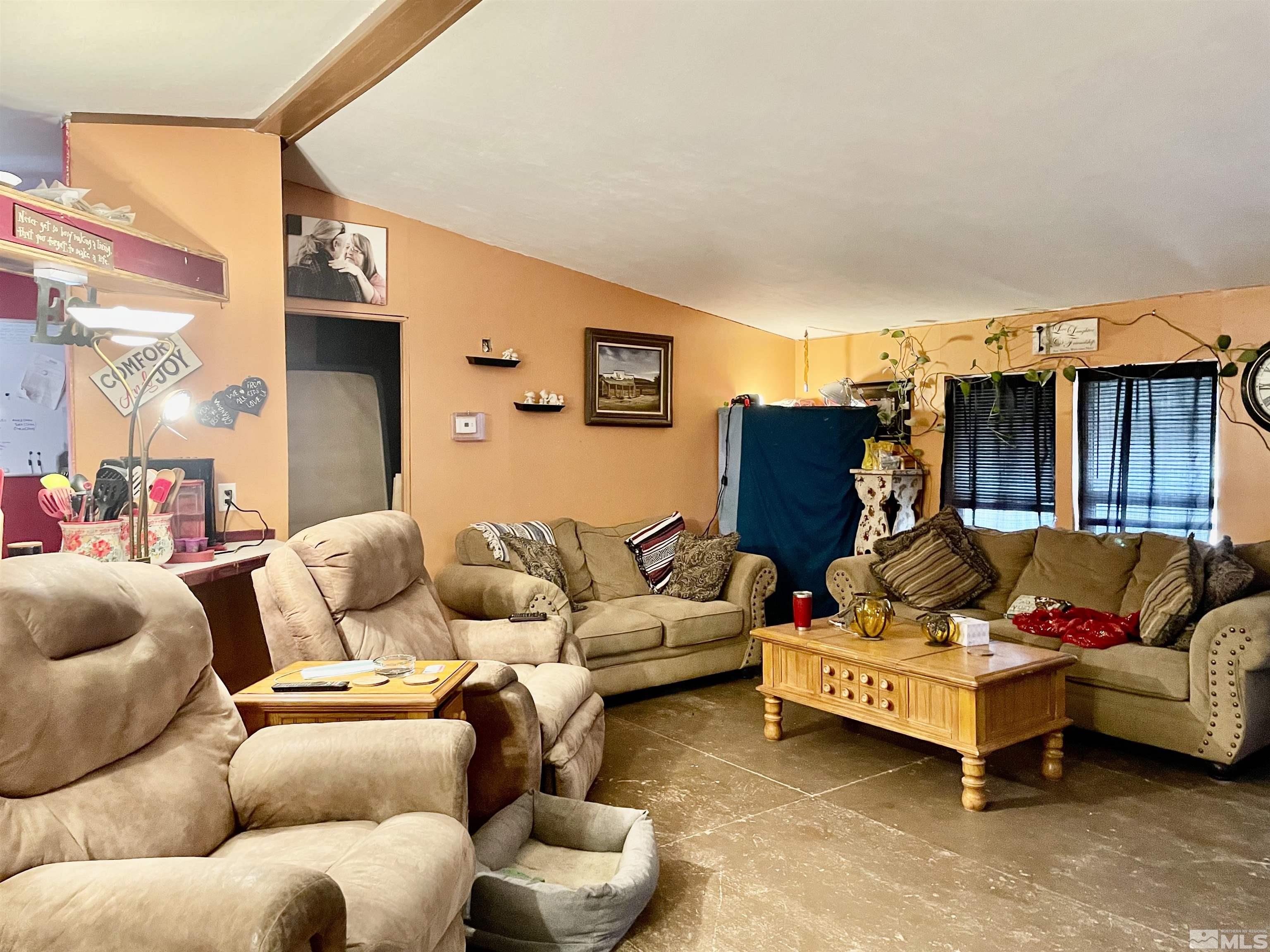 555 Harry Road Winnemucca, NV 89445 - Photo 5 of 11 a living room with furniture and a couch