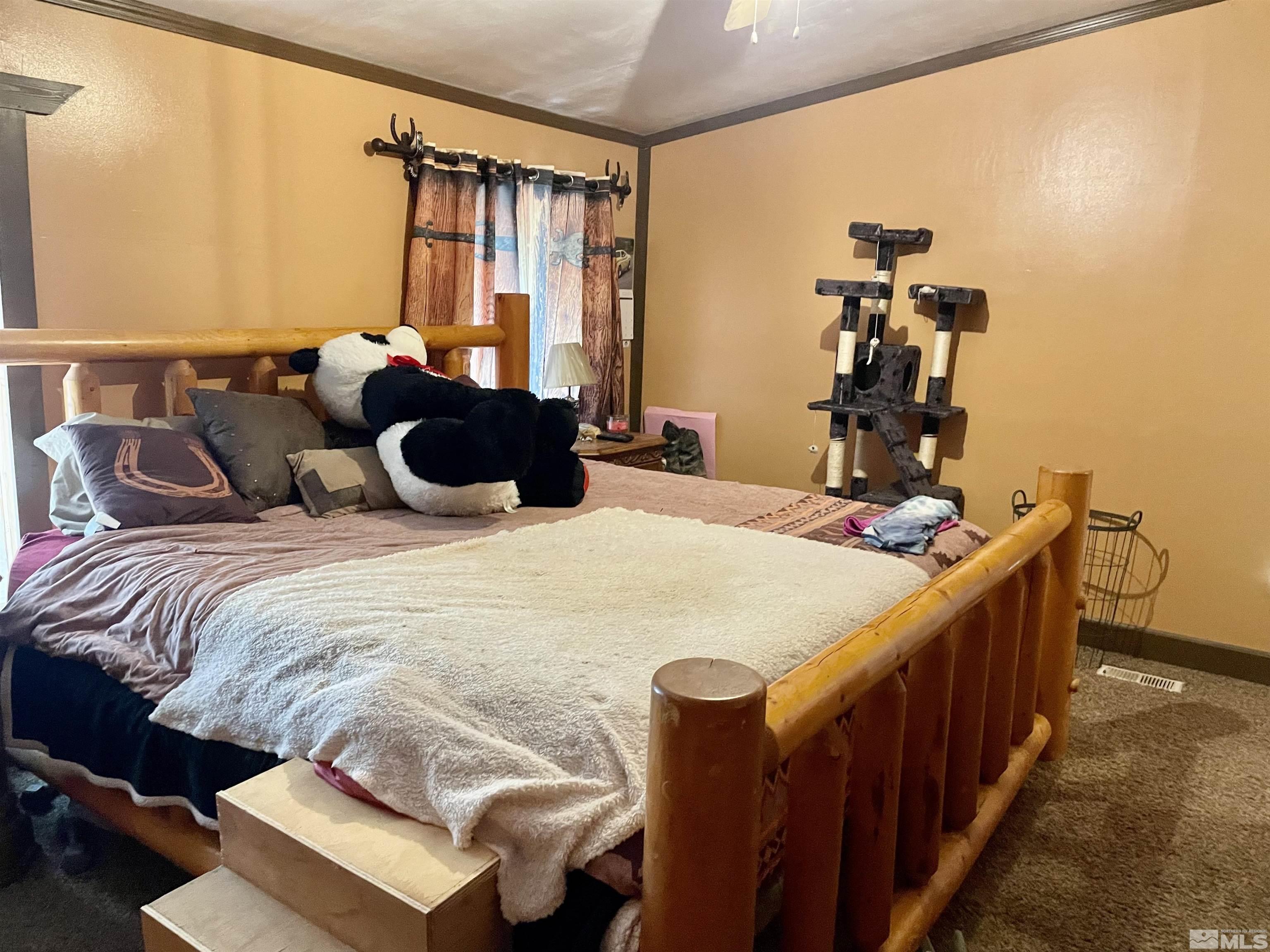 555 Harry Road Winnemucca, NV 89445 - Photo 7 of 11 a bed room with two beds and a desk