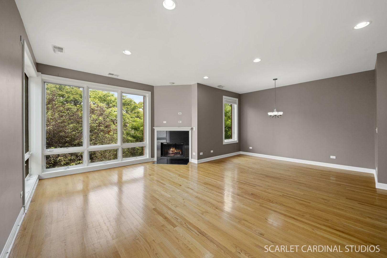 1419 West Fillmore Street, Unit 3W Chicago, IL 60607 - Photo 5 of 26 a view of an empty room with wooden floor and a window