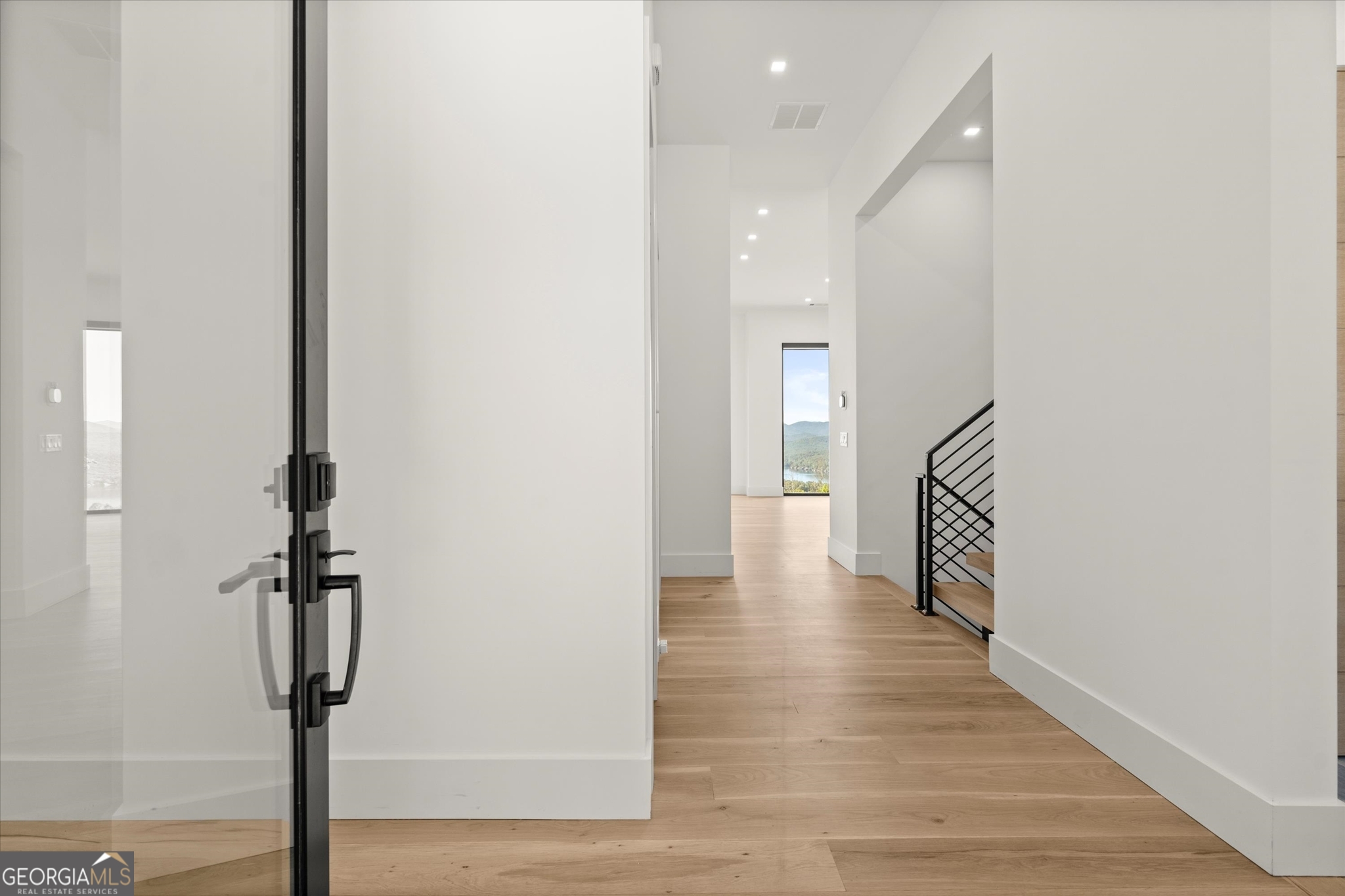 1572 Parker Holifield Road Tiger, GA 30576 - Photo 14 of 84 a view of a hallway with wooden floor and staircase