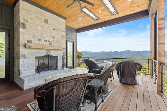 a large kitchen with kitchen island a sink appliances cabinets and a large window