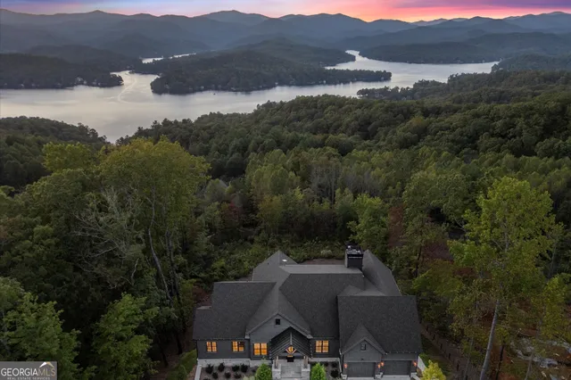 an aerial view of house with mountain view