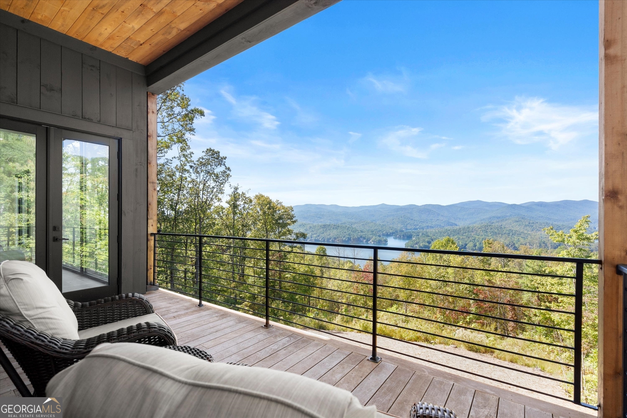 1572 Parker Holifield Road Tiger, GA 30576 - Photo 21 of 84 a view of balcony with couches and wooden floor