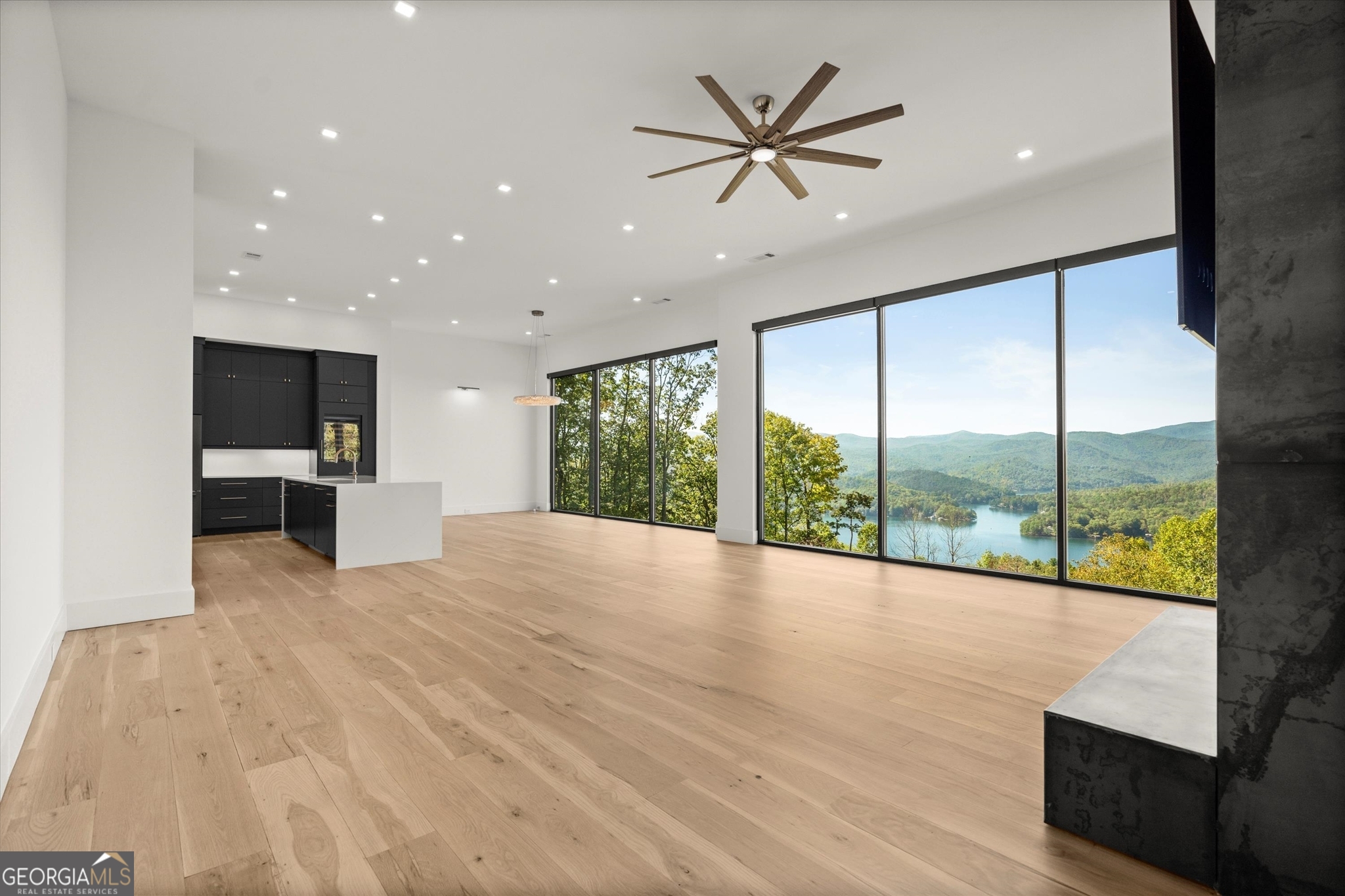 1572 Parker Holifield Road Tiger, GA 30576 - Photo 23 of 84 a view of an empty room with a window and wooden floor
