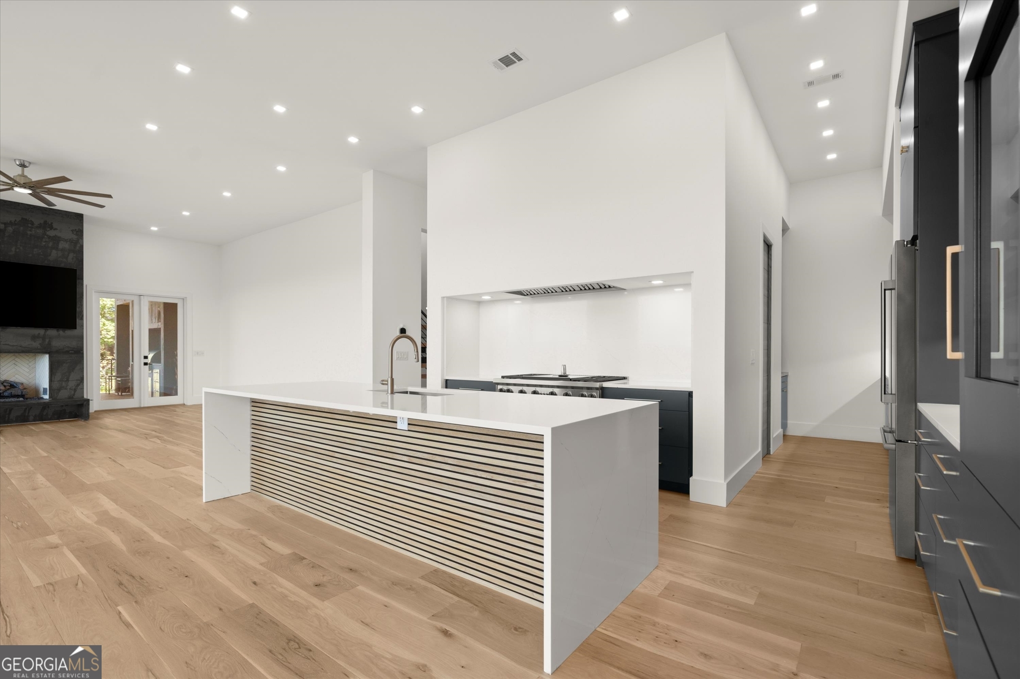 1572 Parker Holifield Road Tiger, GA 30576 - Photo 27 of 84 a large kitchen with stainless steel appliances a large counter top a stove and a refrigerator