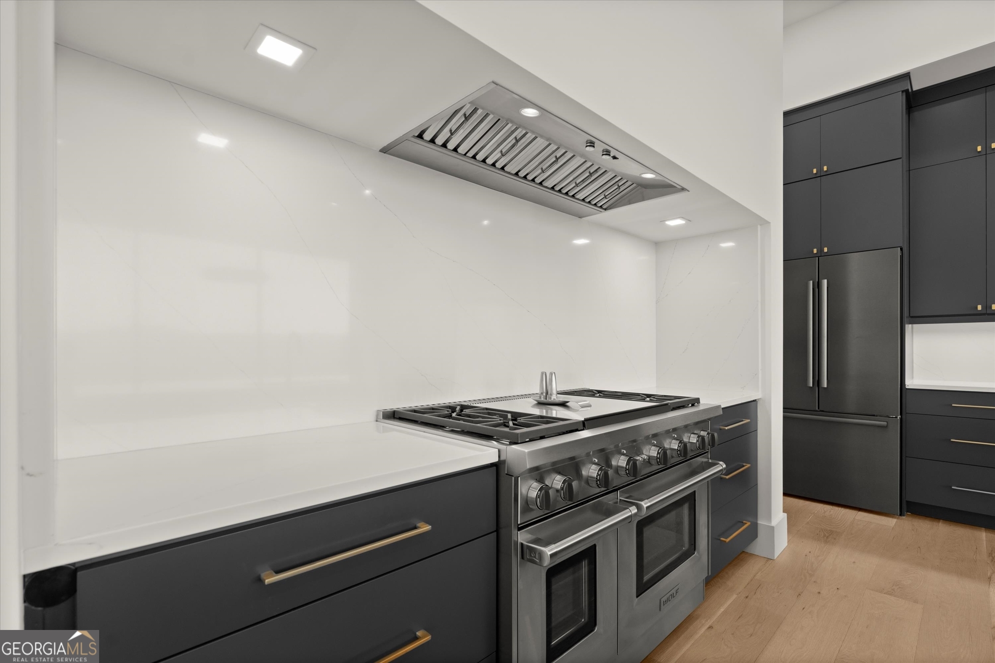 1572 Parker Holifield Road Tiger, GA 30576 - Photo 30 of 84 a kitchen with granite countertop a stove and a refrigerator