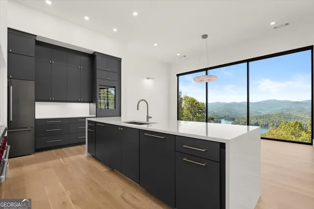 a view of a kitchen with a sink and a microwave